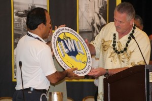 ILWU International President Robert McEllrath and Panama Canal Pilots officer Rainiero Salas view the ILWU logo at the 2012 ILWU Convention in San Diego, June 2012. Panama has been included in the logo in solidarity with the U.S. and Canada with the inclusion of the Panama Pilots union with the ILWU. Photo by Lewis Wright.